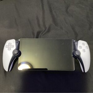 Sony Handheld Console with Black and Gray Controllers